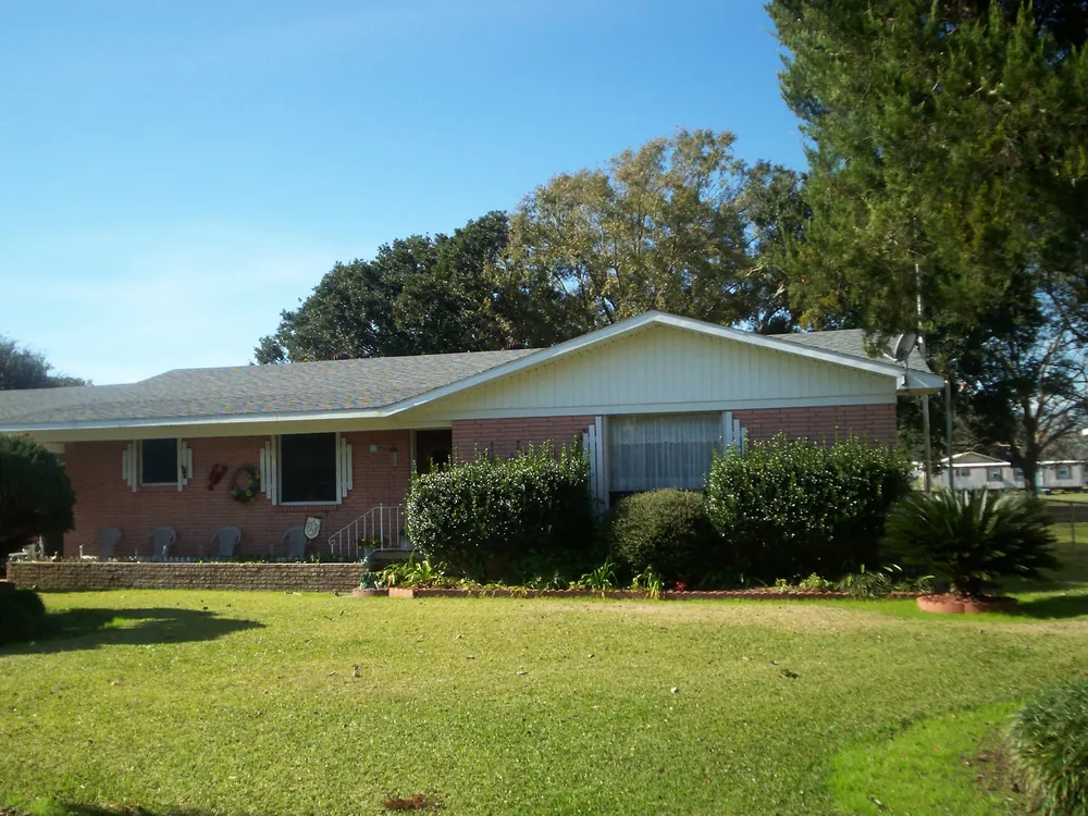 Coastal home before structural lifting and elevation